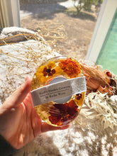 Load image into Gallery viewer, Tea ligh candle holder, marigolds, real dried flower in resin, organic pebbled shape