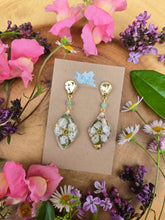 Load image into Gallery viewer, White blossoms on golden posts