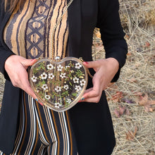 Load image into Gallery viewer, Heart-Shaped Floral clutch, purple sweet pea, resin clutch, removable golden crossbody chain, 6.25 inches x 5.5 inches, white frosty sides