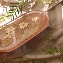 Load image into Gallery viewer, White Larkspur vanity tray, 7 inches x 3.75 inches, Dusty blush taupe & soft lace background, real pressed flower in resin, FDA food safe resin