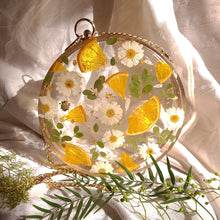 Load image into Gallery viewer, Round Floral Orange Slice Clutch, resin clutch, removable golden crossbody chain, 7 inches in diameter