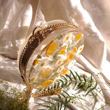 Load image into Gallery viewer, Round Floral Orange Slice Clutch, resin clutch, removable golden crossbody chain, 7 inches in diameter