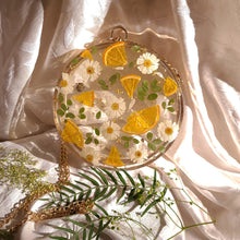 Load image into Gallery viewer, Round Floral Orange Slice Clutch, resin clutch, removable golden crossbody chain, 7 inches in diameter
