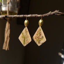 Load image into Gallery viewer, Tea tree earrings, real pressed flower in resin, taupe background