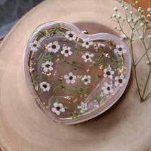 Load image into Gallery viewer, Heart-Shaped Floral clutch, white tea tree blossom, resin clutch, removable golden crossbody chain, 6.25 inches x 5.5 inches, white frosty sides