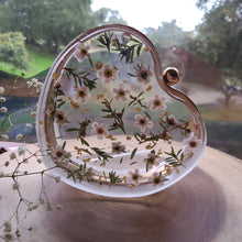 Load image into Gallery viewer, Heart-Shaped Floral clutch, white tea tree blossom, resin clutch, removable golden crossbody chain, 6.25 inches x 5.5 inches, white frosty sides