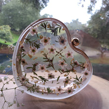 Load image into Gallery viewer, Heart-Shaped Floral clutch, white tea tree blossom, resin clutch, removable golden crossbody chain, 6.25 inches x 5.5 inches, white frosty sides
