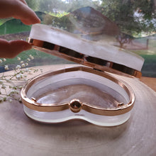 Load image into Gallery viewer, Heart-Shaped Floral clutch, purple sweet pea, resin clutch, removable golden crossbody chain, 6.25 inches x 5.5 inches, white frosty sides