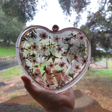 Load image into Gallery viewer, Heart-Shaped Floral clutch, white tea tree blossom, resin clutch, removable golden crossbody chain, 6.25 inches x 5.5 inches, white frosty sides