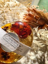 Load image into Gallery viewer, Tea ligh candle holder, marigolds, real dried flower in resin, organic pebbled shape
