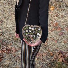 Load image into Gallery viewer, Heart-Shaped  Floral clutch, white tea tree blossom, resin clutch, removable golden crossbody chain, 6.25 inches x 5.5 inches, white frosty sides
