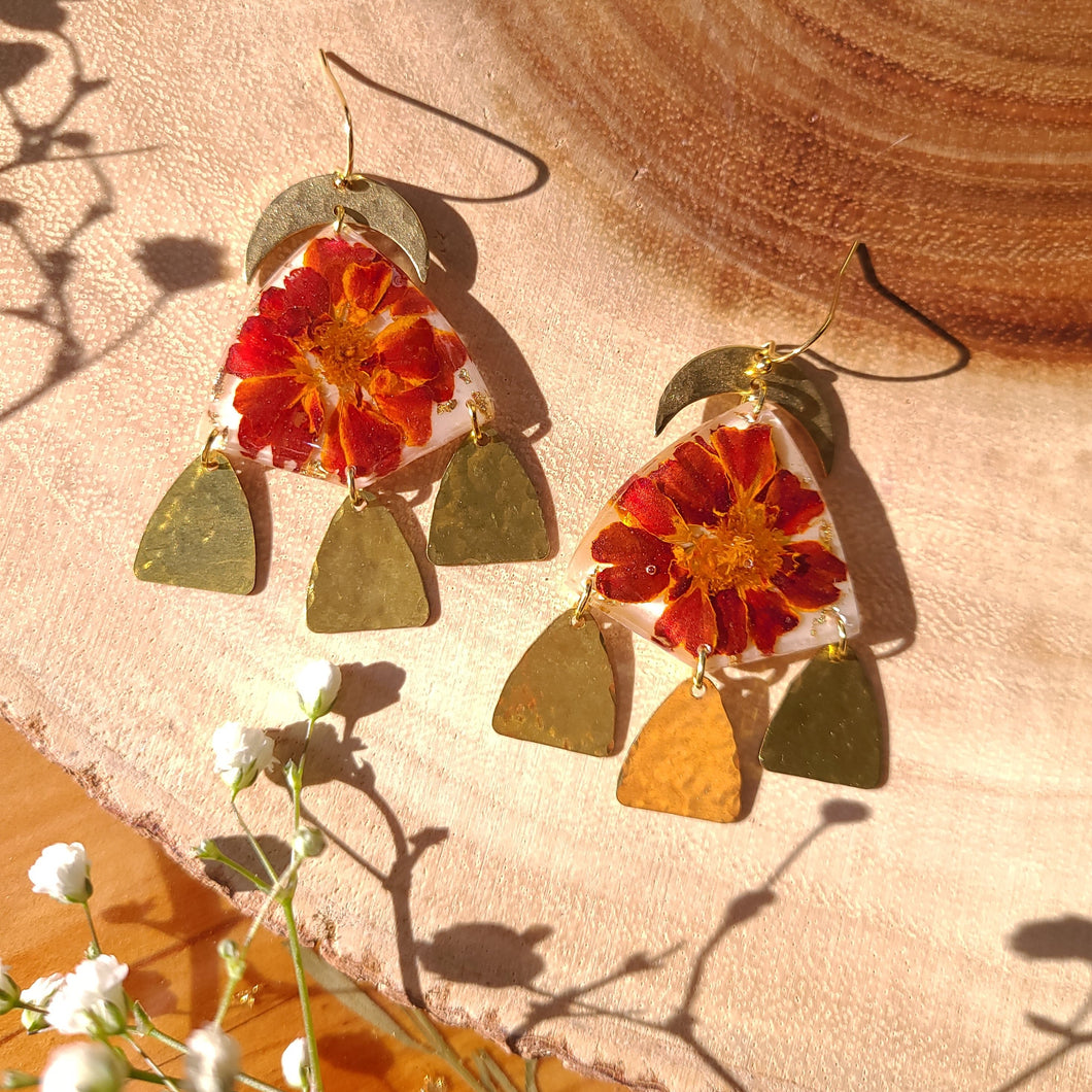 Marigold earrings, real pressed flowers in resin, hmmered brass tassel