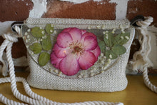 Load image into Gallery viewer, Rose Botanical crossbody bag, 8.25 inches x 6.25 inches daily bag, adjustable/removable straps, magnetic closure, pressed flower in resin, lightweight daily bag
